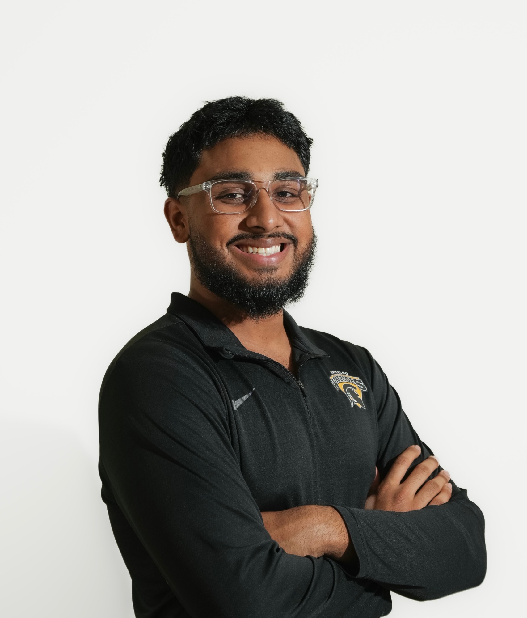 Portrait of a smiling Tailbone Health practitioner with arms crossed